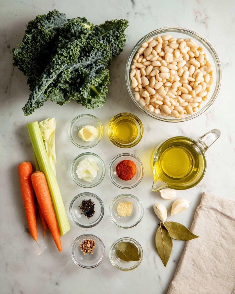 The image shows various ingredients laid out on a white marbled surface. At the top right is a large clear glass bowl full of white beans. Below and to the left are two whole orange carrots and a long light green celery stalk. Next to these is a bunch of leafy dark green kale with textured leaves. Above the kale, from left to right, are two small clear glass bowls with golden olive oil and clear liquid, followed by a white onion. There are six tiny clear glass bowls arranged in two rows, each containing different spices and seasonings in colors such as red, black, green, and white. Four peeled garlic cloves and two dried bay leaves sit toward the right edge. In the bottom right corner, there is a clear glass pitcher tilted and pouring out a small stream of light yellow oil. A beige cloth is partially visible at the bottom right side. All items rest on the clean white marbled surface. photo taken with an iphone --ar 4:5 --v 7