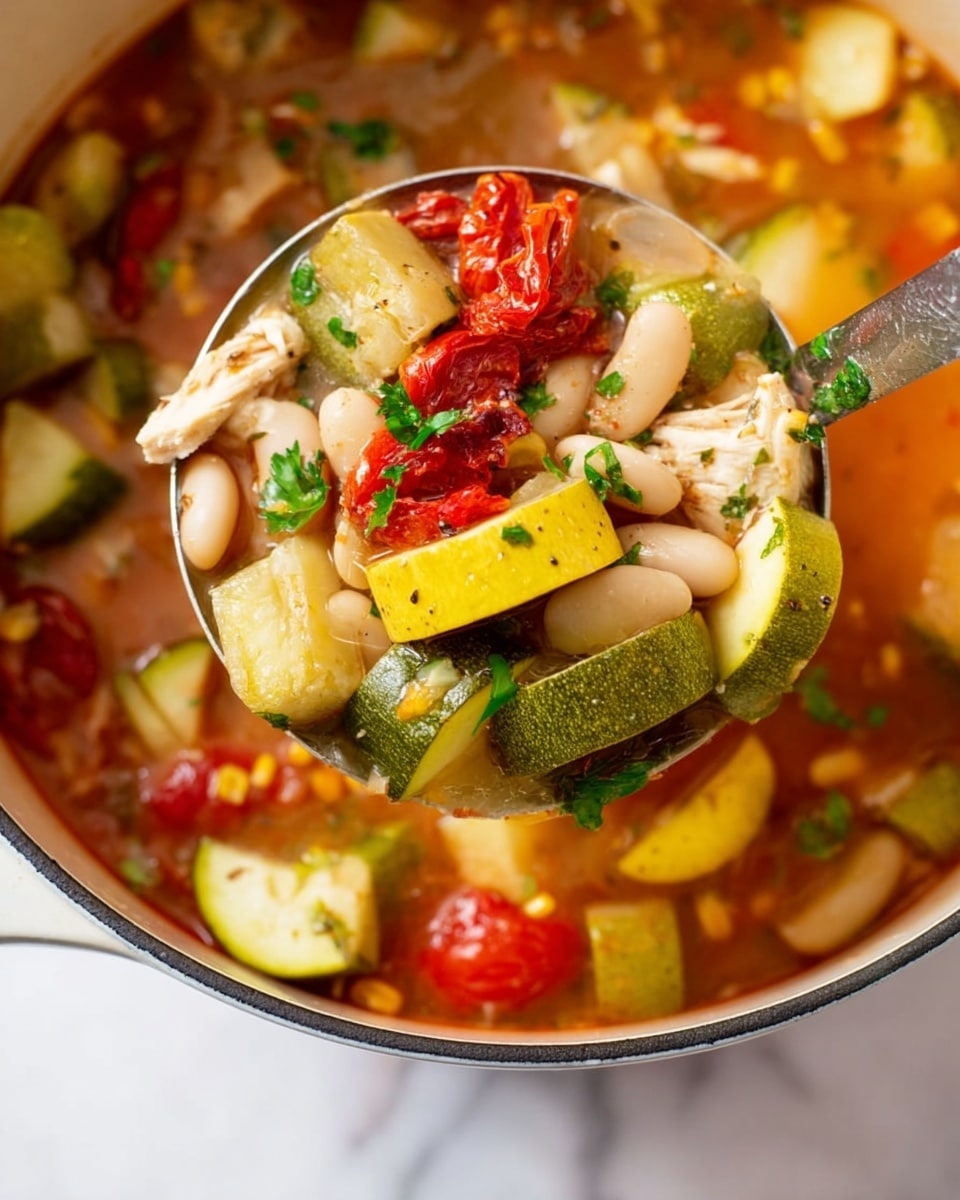 A close-up view of a ladle filled with a colorful soup showing many layers: yellow squash chunks with a smooth texture, large pieces of green zucchini, white beans that are oval and smooth, bright red roasted tomato pieces with char marks, small pieces of light-colored cooked chicken, and bright green parsley leaves on top. The soup in the white pot below has more pieces of yellow corn kernels, white beans, and light green vegetables in a light reddish broth. The surface beneath is a white marbled texture. Photo taken with an iphone --ar 4:5 --v 7