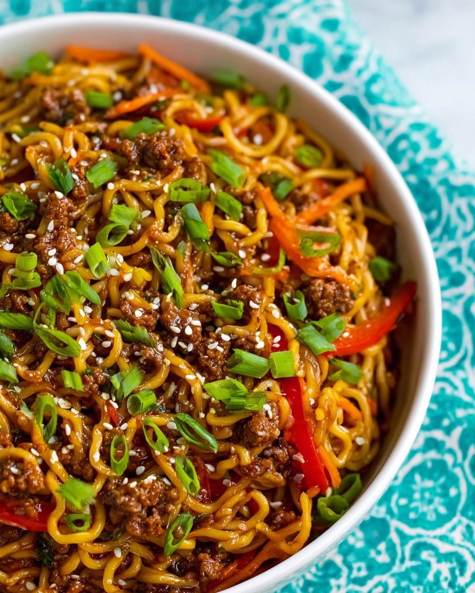 A close-up view shows a spoonful of cooked noodles mixed with ground meat and thin strips of red bell pepper, all coated in a shiny brown sauce. The noodles are twisted and slightly tangled, with the meat pieces dispersed evenly throughout. The background is dark, suggesting the inside of a cooking pot, with some green bits faintly visible below, adding contrast to the warm orange and brown tones of the food. photo taken with an iphone --ar 4:5 --v 7