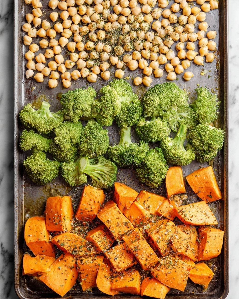 The image shows a baking tray with three layers of food arranged neatly. The top layer has small, round, light beige chickpeas spread out evenly across the tray, some sprinkled with black pepper and herbs. Below them is a middle layer of bright green broccoli florets, fresh and firm-looking, placed in a scattered row. The bottom layer holds large chunks of orange sweet potatoes, cut into irregular pieces and sprinkled with black pepper and seasoning. The tray sits on a white marbled surface. photo taken with an iphone --ar 4:5 --v 7
