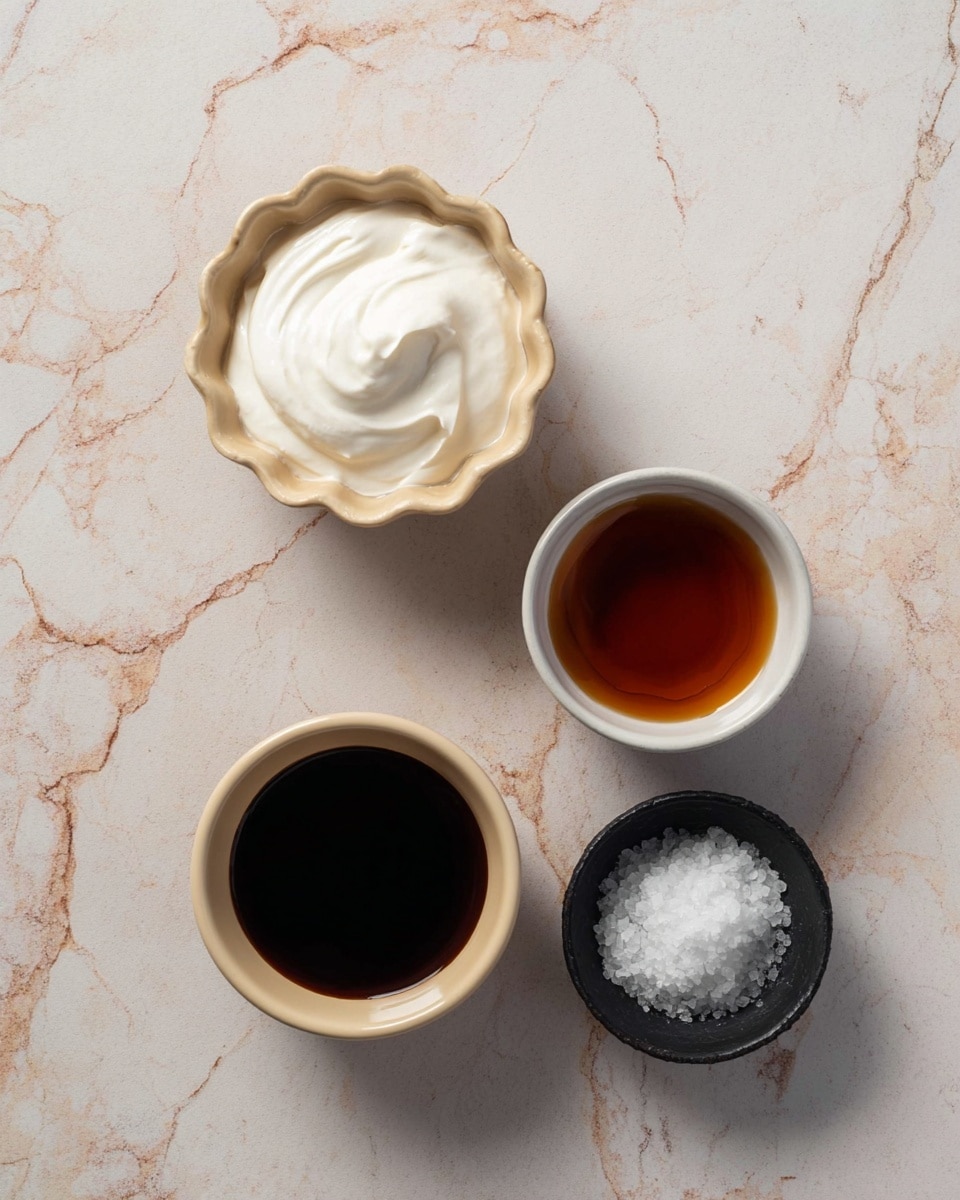 Four small bowls are placed on a white marbled surface. The top left bowl is scalloped and beige, filled with thick white cream with a smooth texture. To its right, there is a plain white bowl holding dark amber liquid with a shiny surface. Below the cream, a smaller beige bowl contains a dark brown liquid, thick and glossy. At the bottom right, there is a small black bowl filled with white coarse salt. photo taken with an iphone --ar 4:5 --v 7