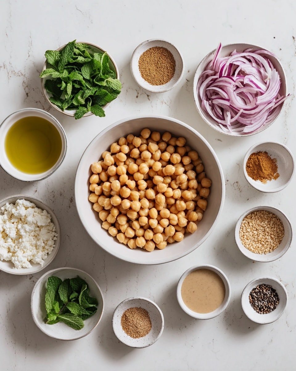 The image shows a white bowl filled with round beige chickpeas in the center on a white marbled surface. Surrounding it are smaller white bowls with various ingredients: thin slices of purple red onion, green fresh cilantro leaves, fresh mint leaves, light brown ground spices, light beige sesame seeds, a small bowl of oil, small piles of salt and black pepper, crumbled white substance, and a small white bowl with a beige sauce. All items are neatly arranged in a circle around the central bowl, creating a clean and organized look. Photo taken with an iphone --ar 4:5 --v 7