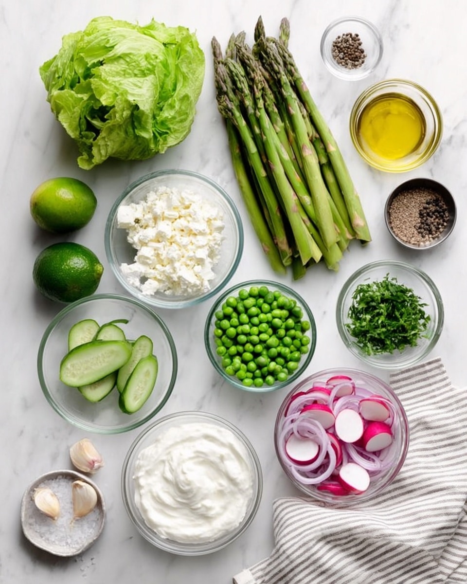 The image shows fresh ingredients arranged neatly on a white marbled surface. At the center, there is a bunch of green asparagus stalks with smooth texture. To the left is a whole green lettuce head with crisp leaves and a green cucumber next to it. Below the asparagus, there is a glass bowl filled with round green peas. To the right of the peas, there is a small glass bowl with thinly sliced red radishes showing white and red layers, and next to it another small glass bowl with thin slivers of purple onion. Above these, there is a bowl filled with white crumbly cheese and a larger bowl with smooth white yogurt or sour cream. There is also a small pile of fresh chopped green herbs in another bowl to the top right, a lime fruit with smooth green skin, a clove of garlic, a small clear bowl of golden olive oil, and a small bowl of light yellow liquid, possible vinegar, placed near the center top. A small bowl with black pepper and a small bowl with salt stand next to the oil and vinegar. A white and gray striped cloth is placed on the right side. photo taken with an iphone --ar 4:5 --v 7