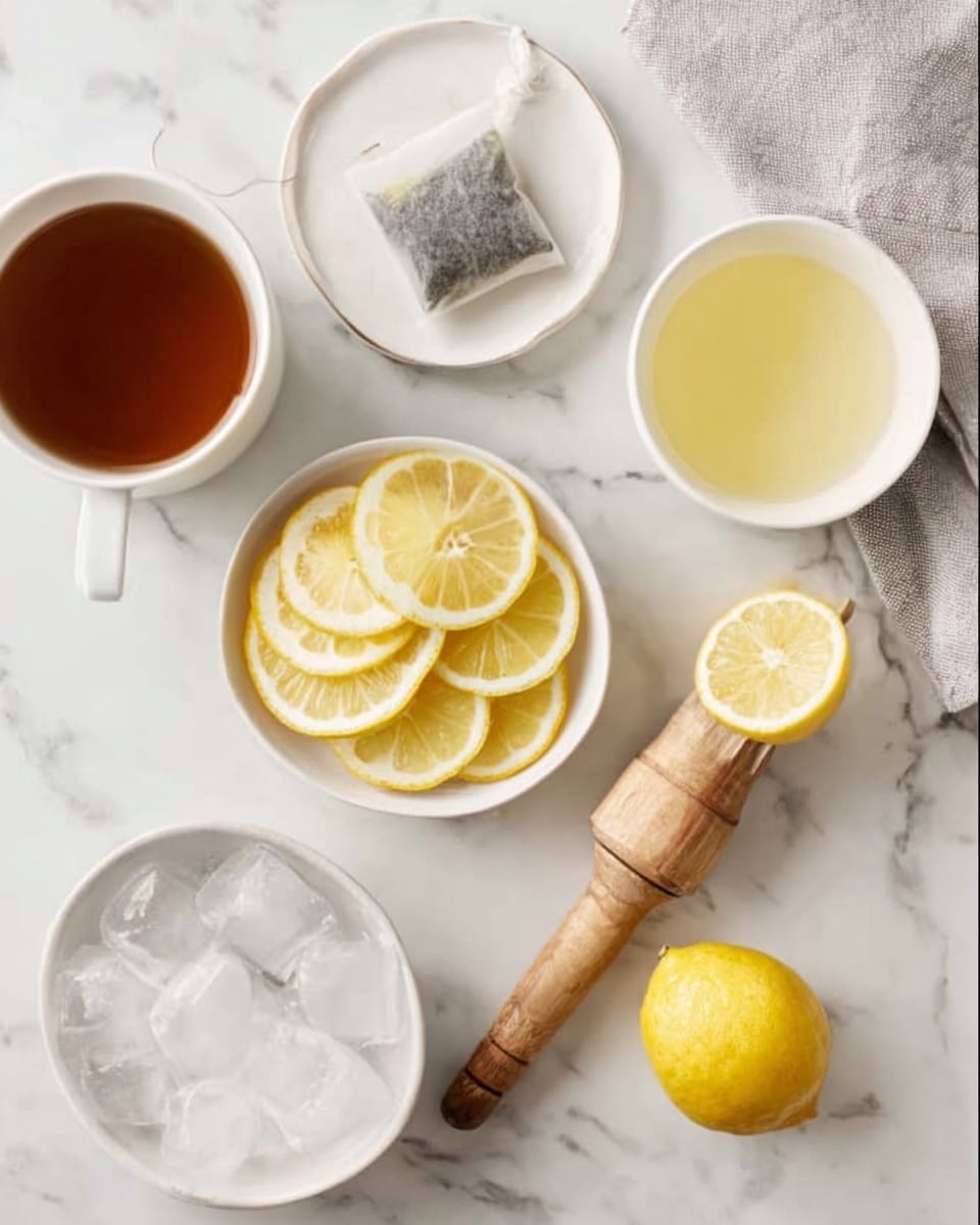 The image shows a white marble surface with five distinct elements arranged neatly. On the top left, there is a white cup filled with dark brown tea. To its right, a white saucer holds a tea bag. In the center, there is a white bowl filled with thin, round lemon slices that look fresh and bright yellow with white rinds. On the top right, a white cup contains light yellow liquid, possibly lemon juice. At the bottom left, a white cup is filled with clear ice cubes, and next to it on the right, a wooden citrus reamer holds a half lemon that is bright yellow with visible juice. A light gray cloth is partly visible on the top right corner. photo taken with an iphone --ar 4:5 --v 7