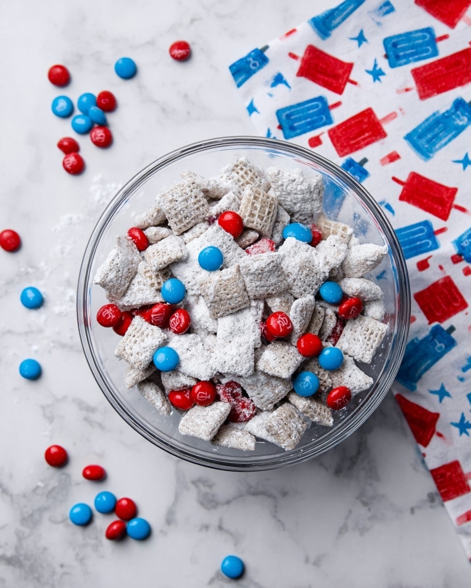 A clear glass bowl filled with a mix of square cereal pieces covered in white powder, scattered with small round candy pieces in bright red and blue colors. Some of the red and blue candies are scattered outside the bowl on a white marbled surface. A colorful cloth with red, blue, and white popsicle patterns is partially visible on the right side of the image. Photo taken with an iphone --ar 4:5 --v 7