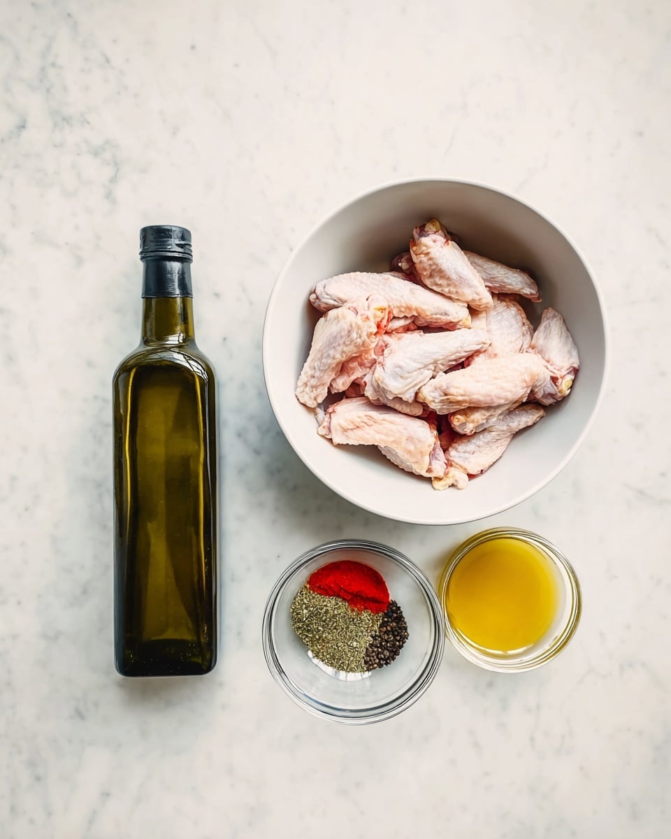 A top view image shows four main items arranged horizontally on a white marbled surface: on the right, a white bowl filled with raw chicken wings with a light pink color; to the left of the bowl, a tall dark green glass bottle of olive oil with a black cap; next is a small clear glass bowl containing mixed spices – bright red, white, black, and green powders; and on the far left, a small glass jar filled with a pale yellow liquid. The overall scene has bright, natural lighting highlighting the textures and colors clearly, photo taken with an iphone --ar 4:5 --v 7