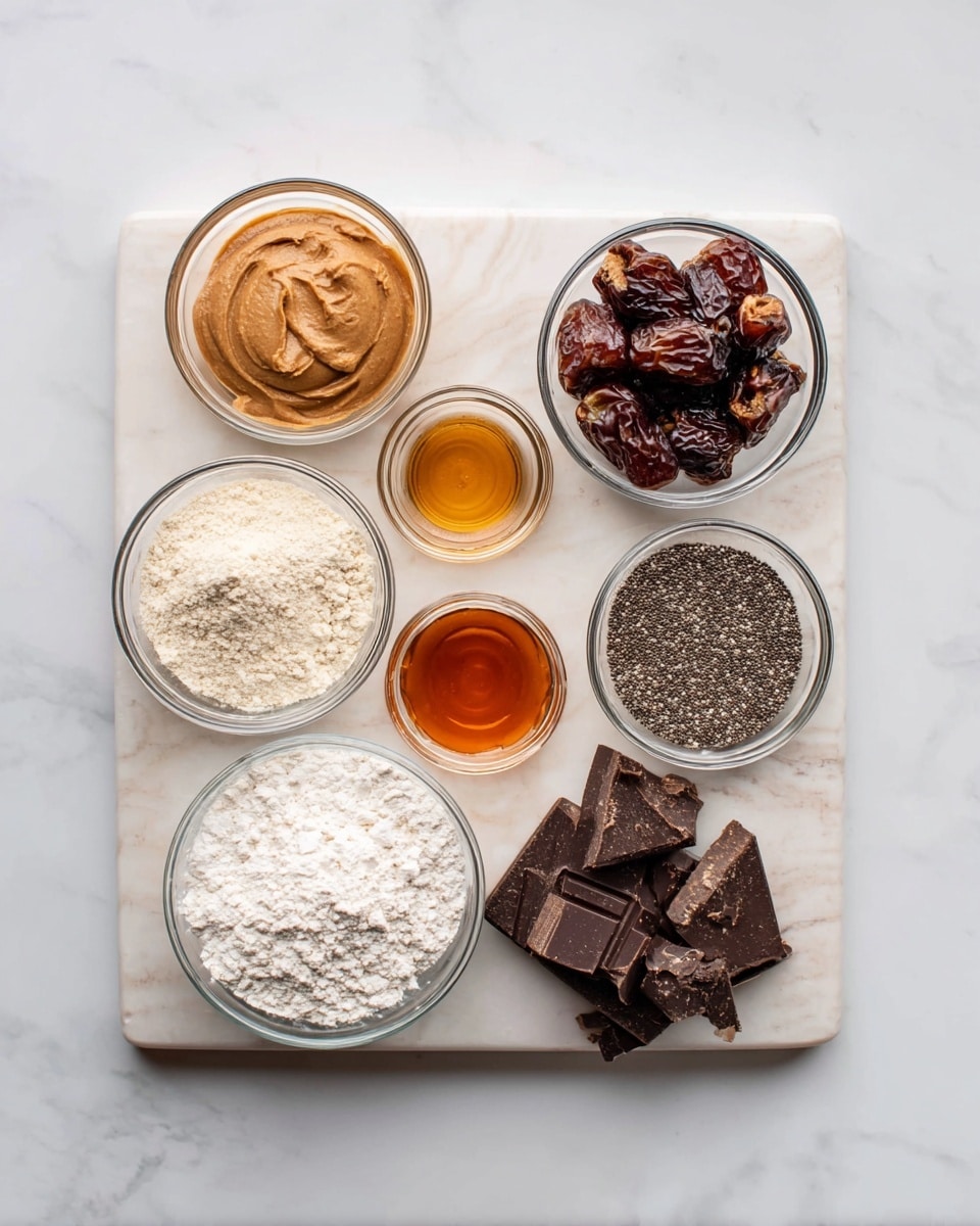 A flat white marbled board holds seven small clear glass bowls arranged in a slightly curved pattern. From left to right, the first bowl contains smooth light brown peanut butter with a slightly rough texture. Next, a bowl filled with dark brown chopped dates showing their chewy interior sits above a bowl of pale off-white fine almond flour. To the right of the almond flour is a bowl of ground black chia seeds with a grainy texture. Below these three, a bowl of white flour with a soft powdery texture is on the left. A small bowl of amber-colored liquid honey sits in the center. Finally, on the right, a bowl holds chunks of dark chocolate with a glossy surface and some ridges. The scene is set on a clean white marbled surface, photo taken with an iphone --ar 4:5 --v 7