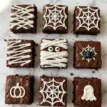 Spooky Halloween Brownies with Mummy, Spider Web, and Ghost Decorations Recipe